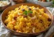 Mishti Pulao z marchewką podane z kardamonem, orzechami nerkowca i rodzynkami
