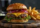 Bison burger with melted cheese and fresh vegetables